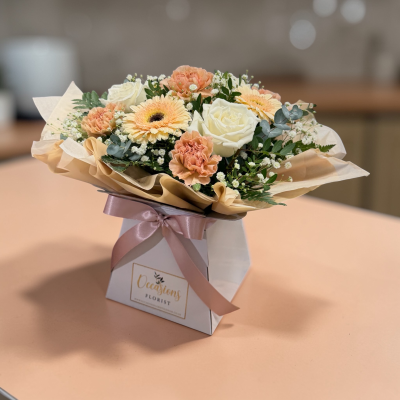 peaches and creams - Peaches and creams is one of our best selling products, Nude, peach and cream flowers brought together and exquisitely gift wrapped, arranged in floral foam for easy care.