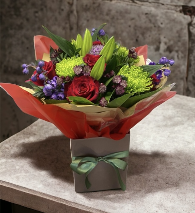 Emerald Kiss - Gift wrapped in a hand-tied and presented in a box which contains water. Hand delivered by us, make them smile with this bright collection of flowers. perfect for any occasion. can be transferred to a vase if preferred.