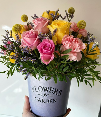 Pot of Happiness - yellow and pink blooms arranges in floral foam for easy care