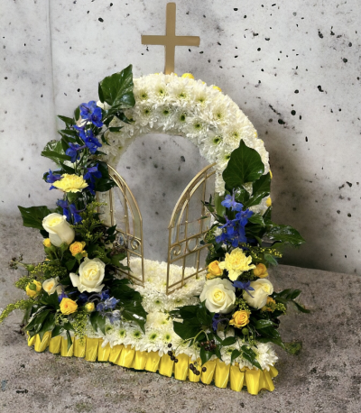 Natural Gates of Heaven - It has a perfect balance of colour and lush greenery really giving the effect of a natural beautiful over grown gate. It is arranged on a wet floral foam frame. Easy to carry. Different colours can be requested in the notes. Perfect for a funeral tribute, memorial or grave.