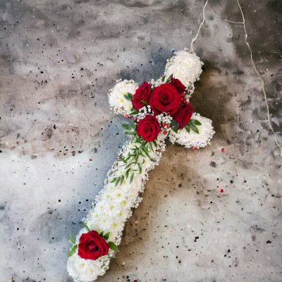 Cross Tribute - chrysanthemum base and a cluster of seasonal flowers to match. suitable for a funeral, grave or remeberance.