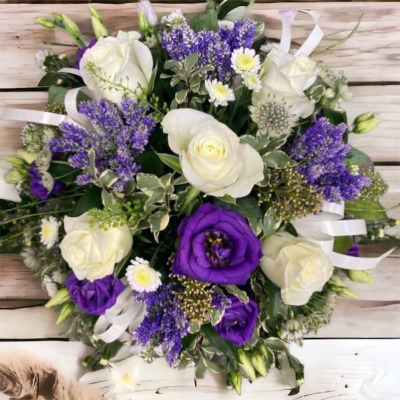 Funeral Posy - This funeral tribute can be made in any colours requested and consist of a collection of seasonal flowers arranged in a wet floral spong sat in a plastic tray. easy to carry and weighted down with the watered base.